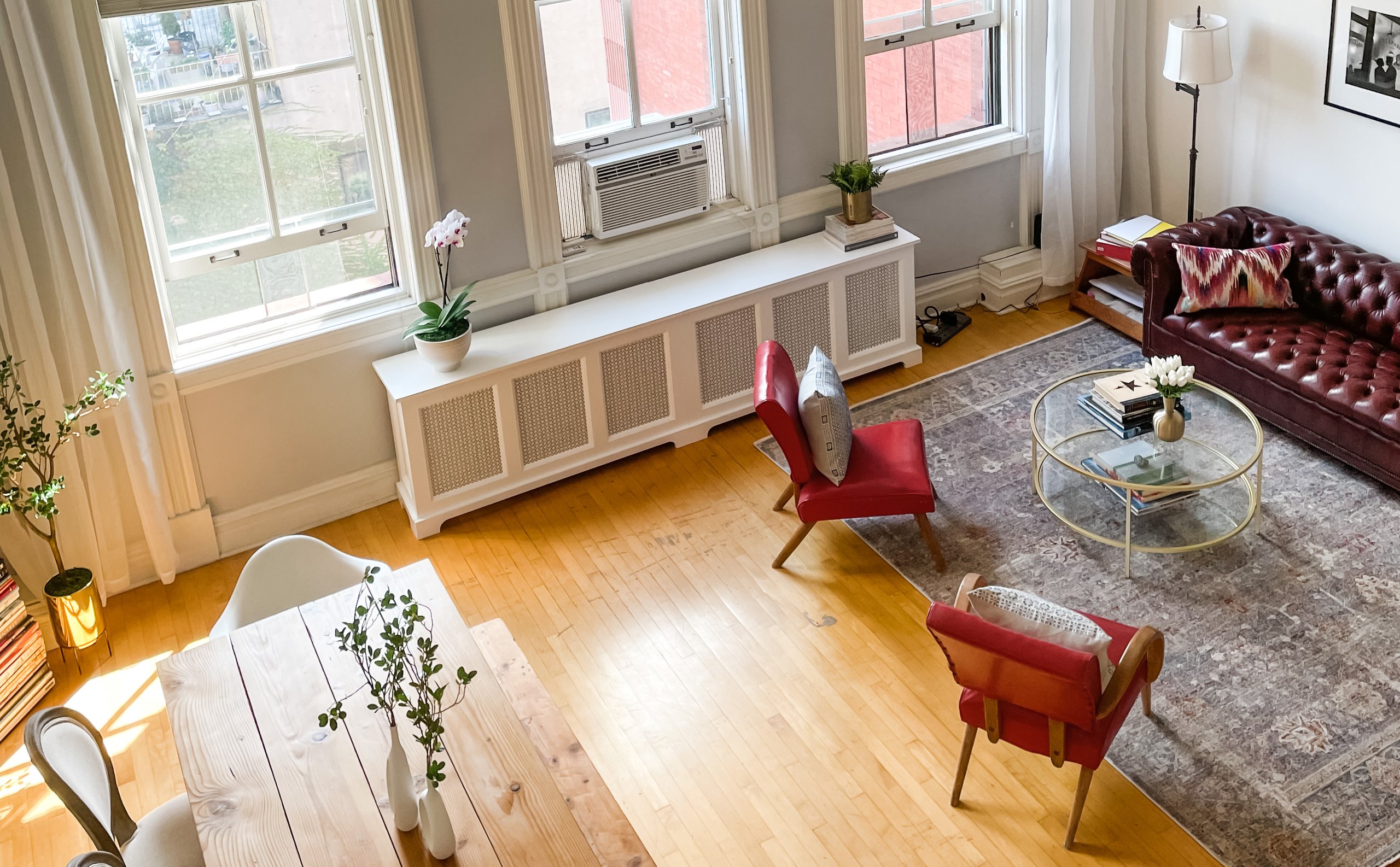 Bird's-eye view of living room with red accent chairs